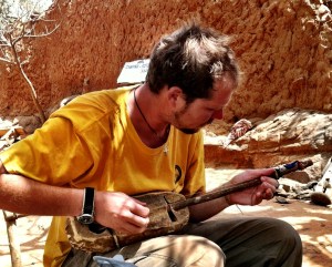 Jacob playing the gourd at Consougou Ley
