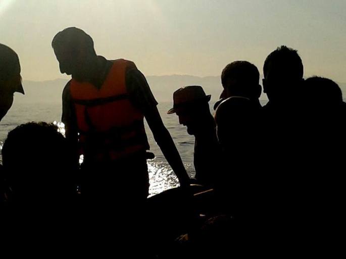 Receiving one of those calls on the" floating carpet," the "Captain" in orange vest, my travel mates looking directly towards their future. (Taken by Hadikun)